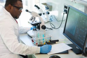 African-american Man Working In Lab. Scientist Doctor Making Medical Research